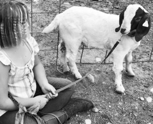 young girl with goat