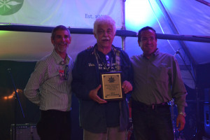 Jeffrey Steinborn being given a Lifetime Achievement Award for Cannabis Advocacy at Seattle Hempfest in 2018. Left to right: Vivian McPeak, Jeff Steinborn, Jon Davis.