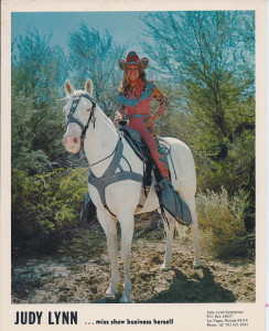 Judy Lynn atop her trusty white horse