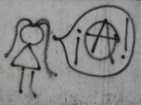 Graffiti stick figure girl with speech bubble inside speech bubble is anarchy symbol