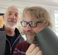 Revolutions Per Movie host Chris Slusarenko joins musician Victor Krummenacher onstage Revolutions Per Movie host Chris Slusarenko joins musician Victor Krummenacher onstage with S.W. Conser on Words and Pictures on KBOO Radio